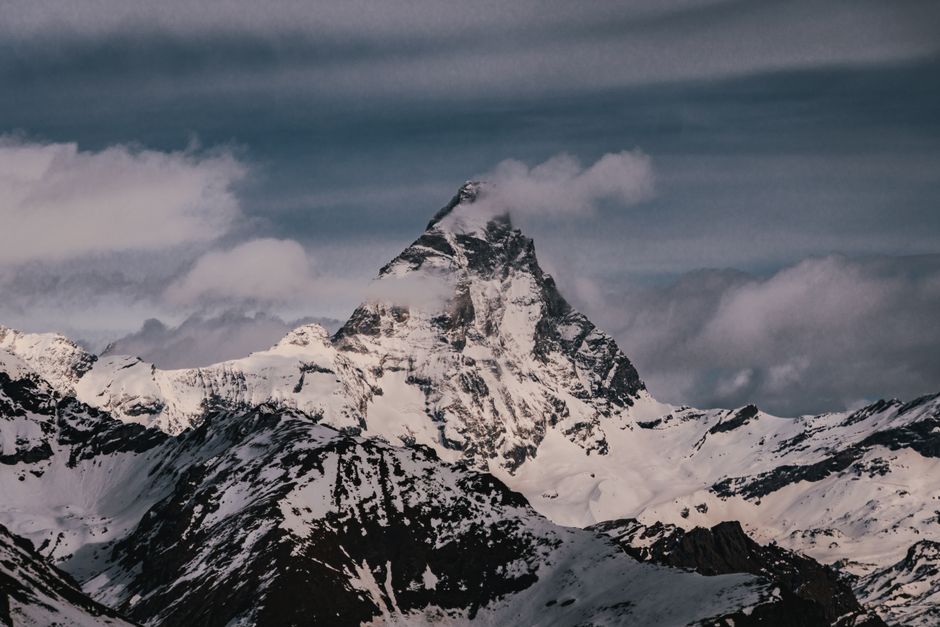 Majestic winter landscape of the Matterhorn peak in Aosta Valley, Italy, showcasing snow-covered mountains.